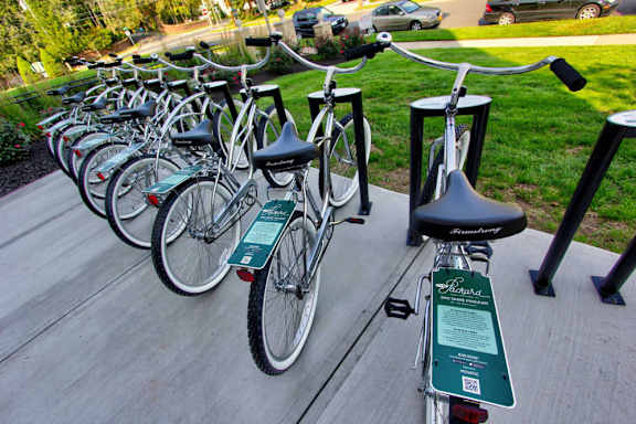 a row of bikes parked on a sidewalk at The Packard, West Hartford, Connecticut