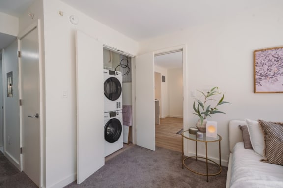 a living room with a washing machine and a dryer in it&#xA0;at Up House, Connecticut