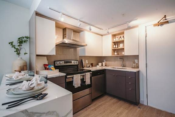 a kitchen with a stove and a sink