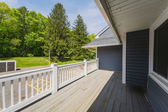 a deck with a view of a yard and a house at Woodbury, Connecticut, 06798