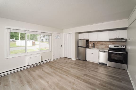 kitchen with a large window and a stove at Woodbury, Connecticut