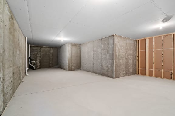 the living room is stripped out and ready to be remodeled in concrete and wood