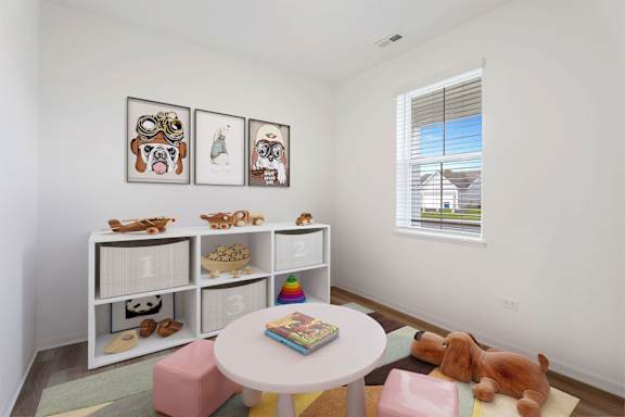 A white shelf with numbered boxes and a dog toy on the floor.