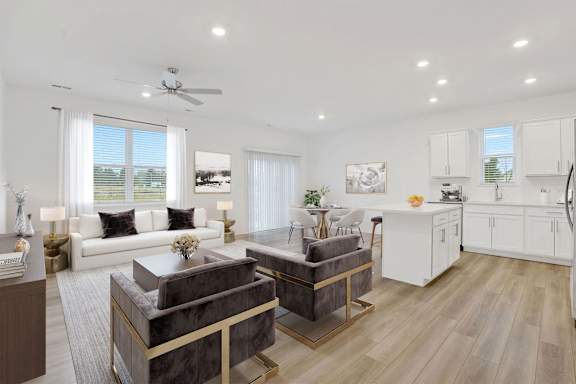 A modern living room with a grey sofa and a white couch.