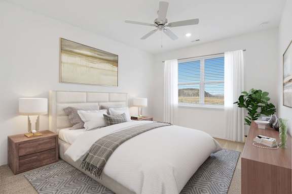 A bedroom with a large bed, a ceiling fan, and a window with blinds.