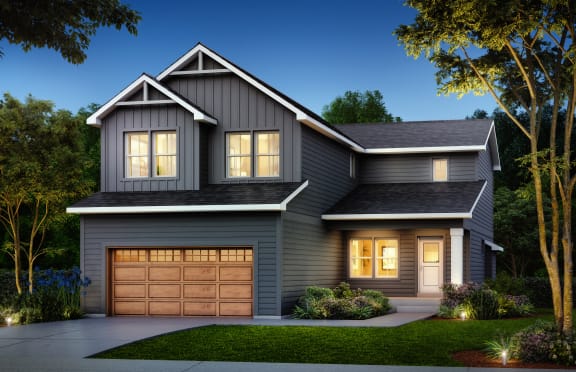 a home with a garage door in front of it