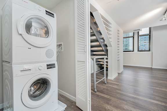 A white washing machine and dryer in a laundry room.