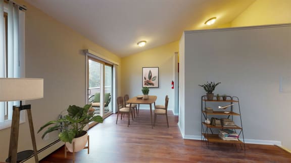a dining room with a table and chairs