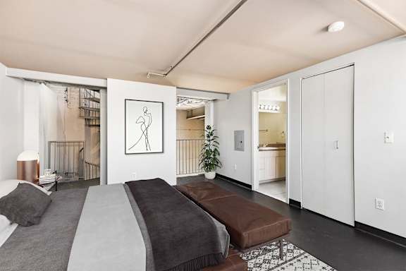 a bedroom with a bed and a closet