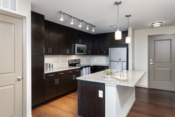 radius at the banks apartments kitchen with dark espresso wood cabinets