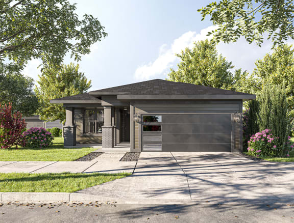 a home with a gray roof and gray garage doors