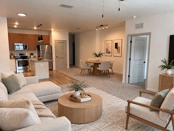 A modern living room with a grey sofa set and a coffee table.