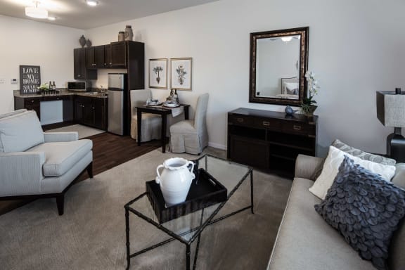 a spacious living room with a kitchen in the background at Arbor Hills, Florida