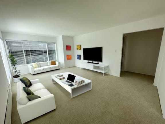 a living room filled with furniture and a flat screen tv