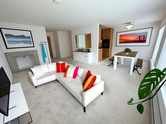 a living room filled with furniture and a fire place