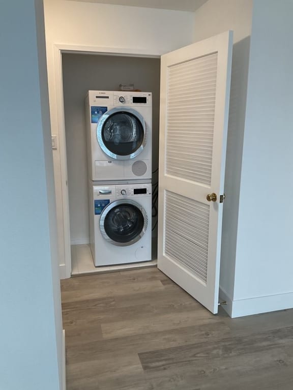 a washer and dryer in a small closet