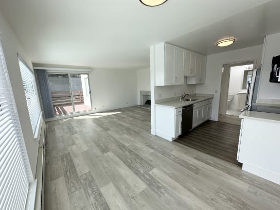 a kitchen and living room in an apartment