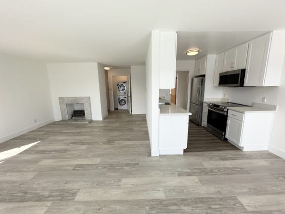 a kitchen and living room in a 555 waverly unit