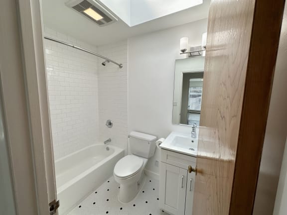 a bathroom with a toilet sink and bathtub