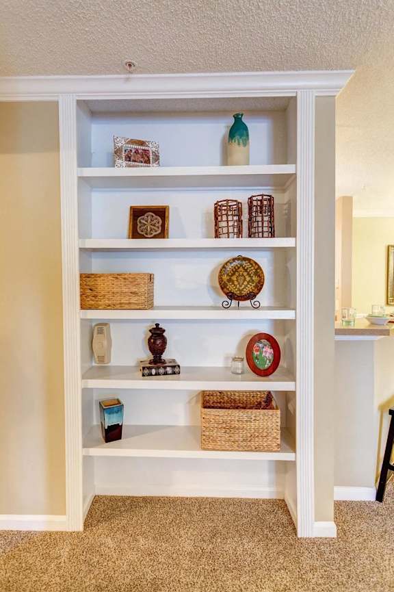 a book shelf with many different items on it