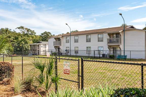 leash-free pet park and building exteriorat 701 South Apartments in Mobile, AL
