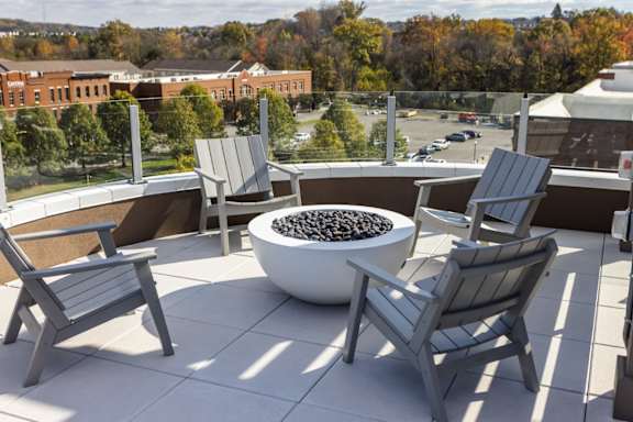Rooftop terrace with firepit and chairs at 2020 Providence in Huntsville, AL.