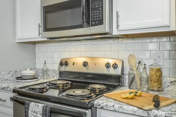 a kitchen with a stove and a microwave