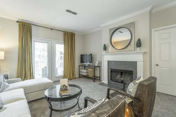 a living room with a couch and a fire place