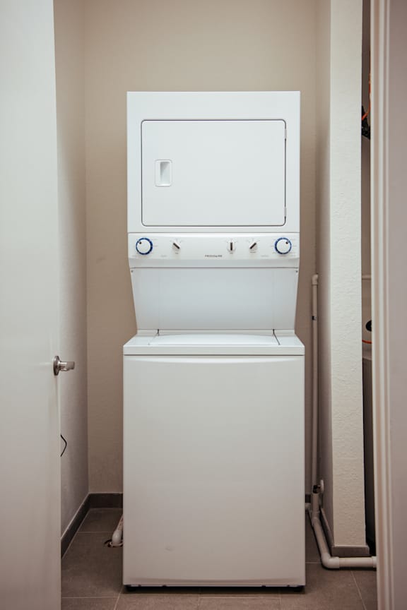 a washer and dryer in a closet in a home at 20 Midtown, Birmingham, Alabama