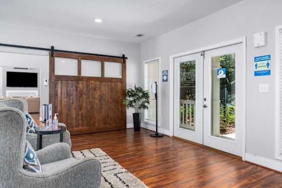 Clubhouse features a barndoor to partition off the billiards pool table room at Summerchase at Riverchase in Hoover, Alabama