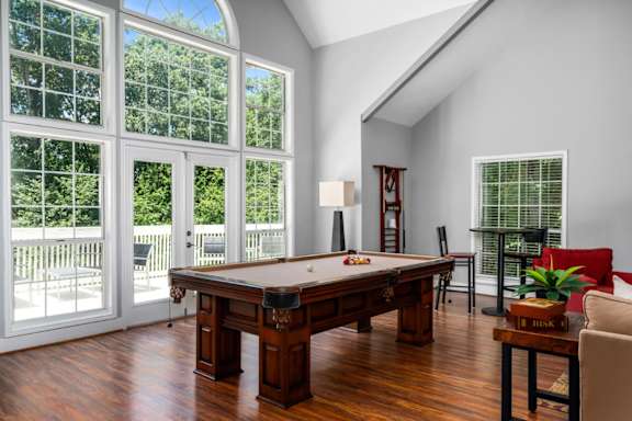 Clubhouse featuring seating and a pool table at Summerchase at Riverchase in Hoover, Alabama