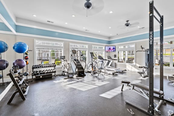 A well-equipped gym with a variety of exercise equipment.