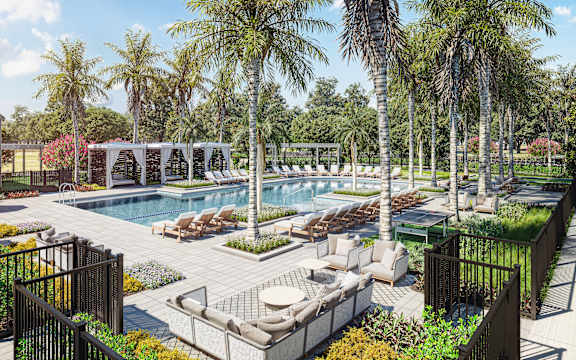 A pool surrounded by palm trees and lounge chairs.