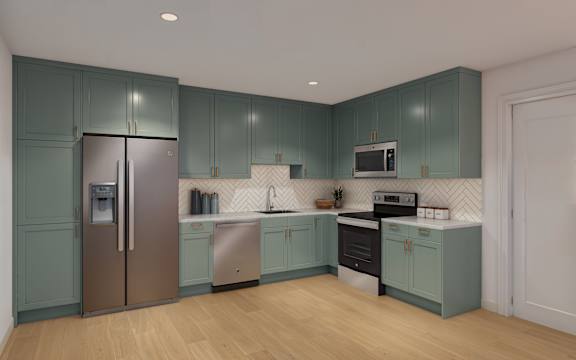 A kitchen with a refrigerator, sink, and oven.