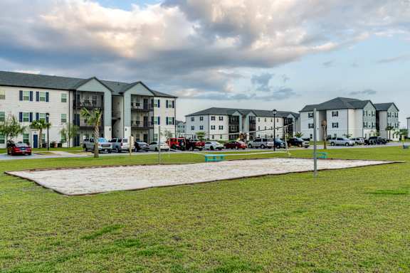 sand volleyball court at The Reserve of Foley Apartments in Foley, AL