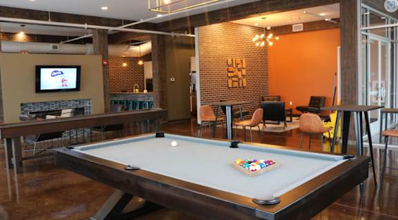 Clubhouse gameroom with pool table, full kitchen, and social lounge. at Promenade at Founders Square Apartments in Indianapolis, IN