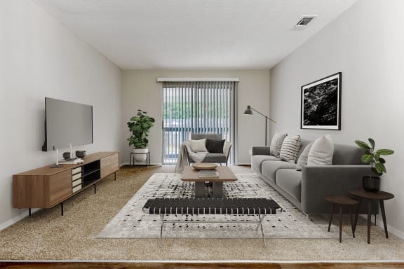 a spacious living room with white walls and carpeting
