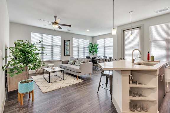 Open concept living area with kitchen island at The Mark at Midtown Apartments, Dallas, 75231