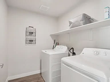 Full size In unit white washer and dryer in an apartment at V on Broadway