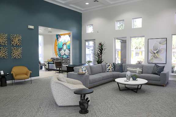 A living room with a grey sofa, a yellow chair, and a coffee table.
