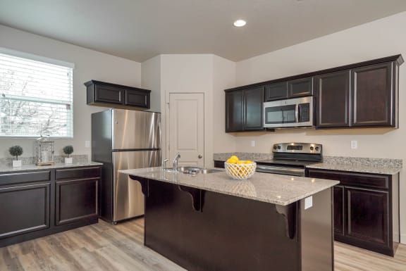 Kitchen with cabinets at The Village at Church &amp; Main, Layton, UT