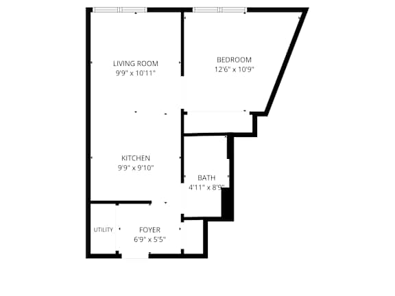 A floor plan of a home with a living room, bedroom, kitchen, bath, and foyer.