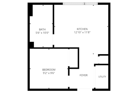 A floor plan of a small apartment with a bedroom, bathroom, kitchen, foyer and utility space.
