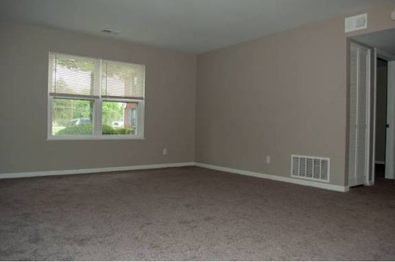 A room with a window and a door.