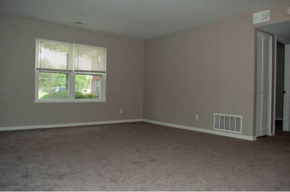 A room with a window and a door.