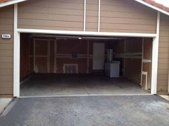 the inside of a garage with the door open at Oak Grove Terrace California, Oak Grove Rd