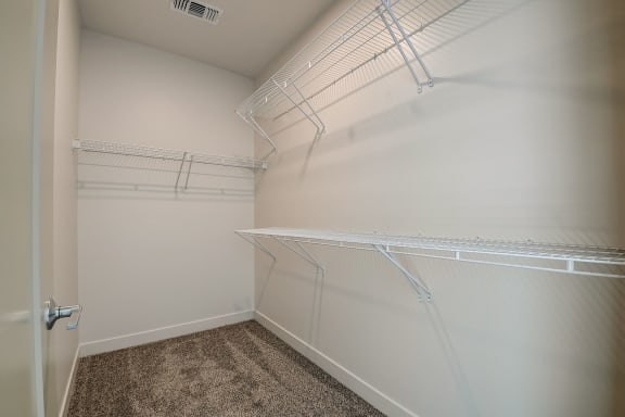a spacious walk in closet at the historic electric building in fort worth, tx