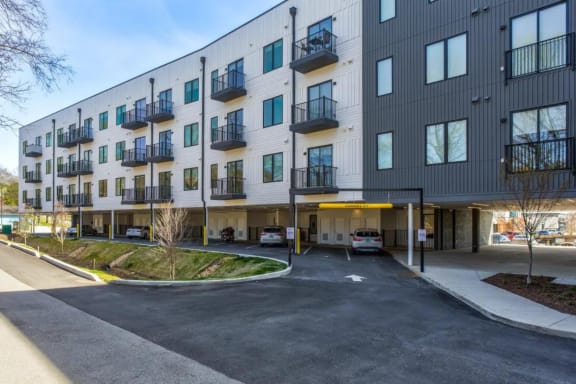 the exterior of a building with a parking lot