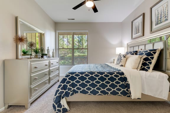a bedroom with a bed and a dresser