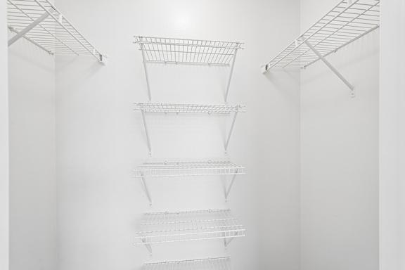 Empty shelves in a white room.
